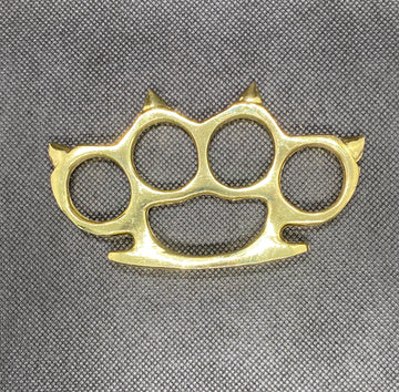 BRASS KNUCKLE DUSTER WITH METAL SPIKES.